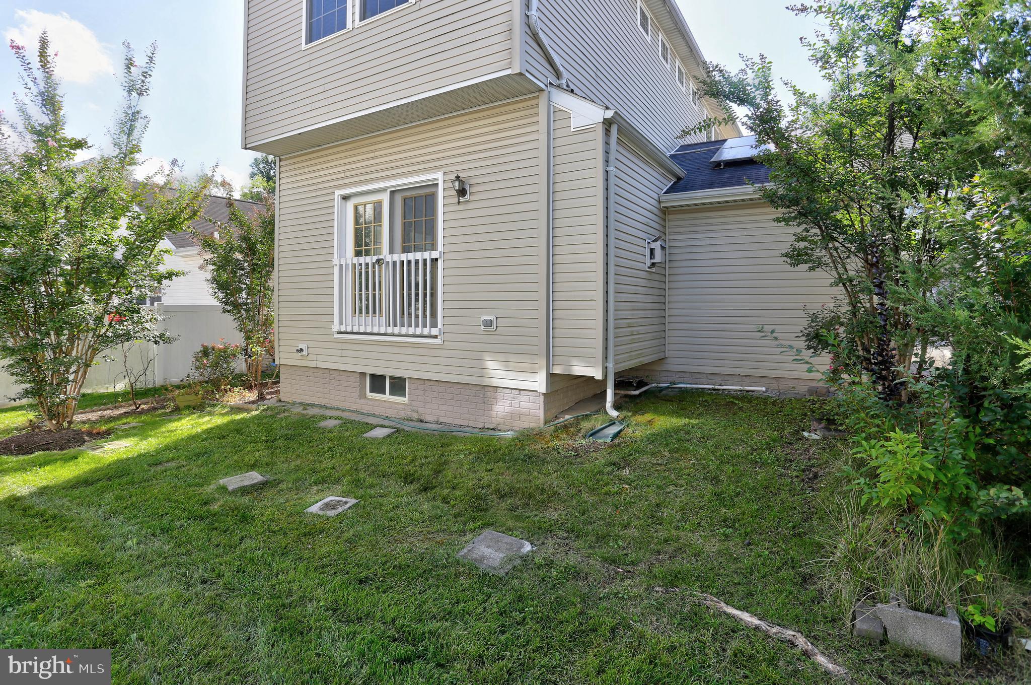 7629 Bluff Point Lane Elkridge, MD 21075 - Photo 24 of 31 a view of a house with a backyard
