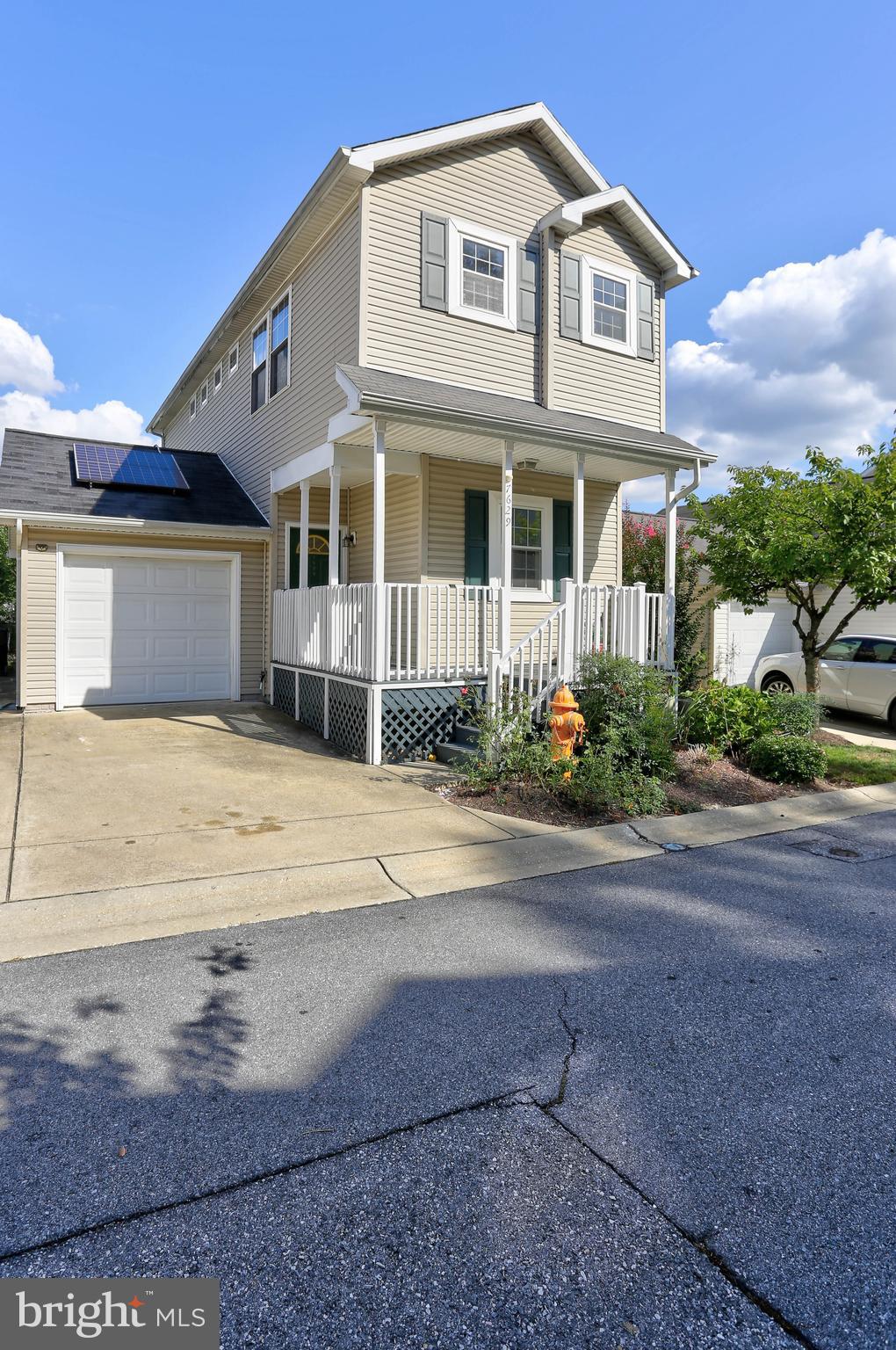 7629 Bluff Point Lane Elkridge, MD 21075 - Photo 25 of 31 a front view of a house with a yard