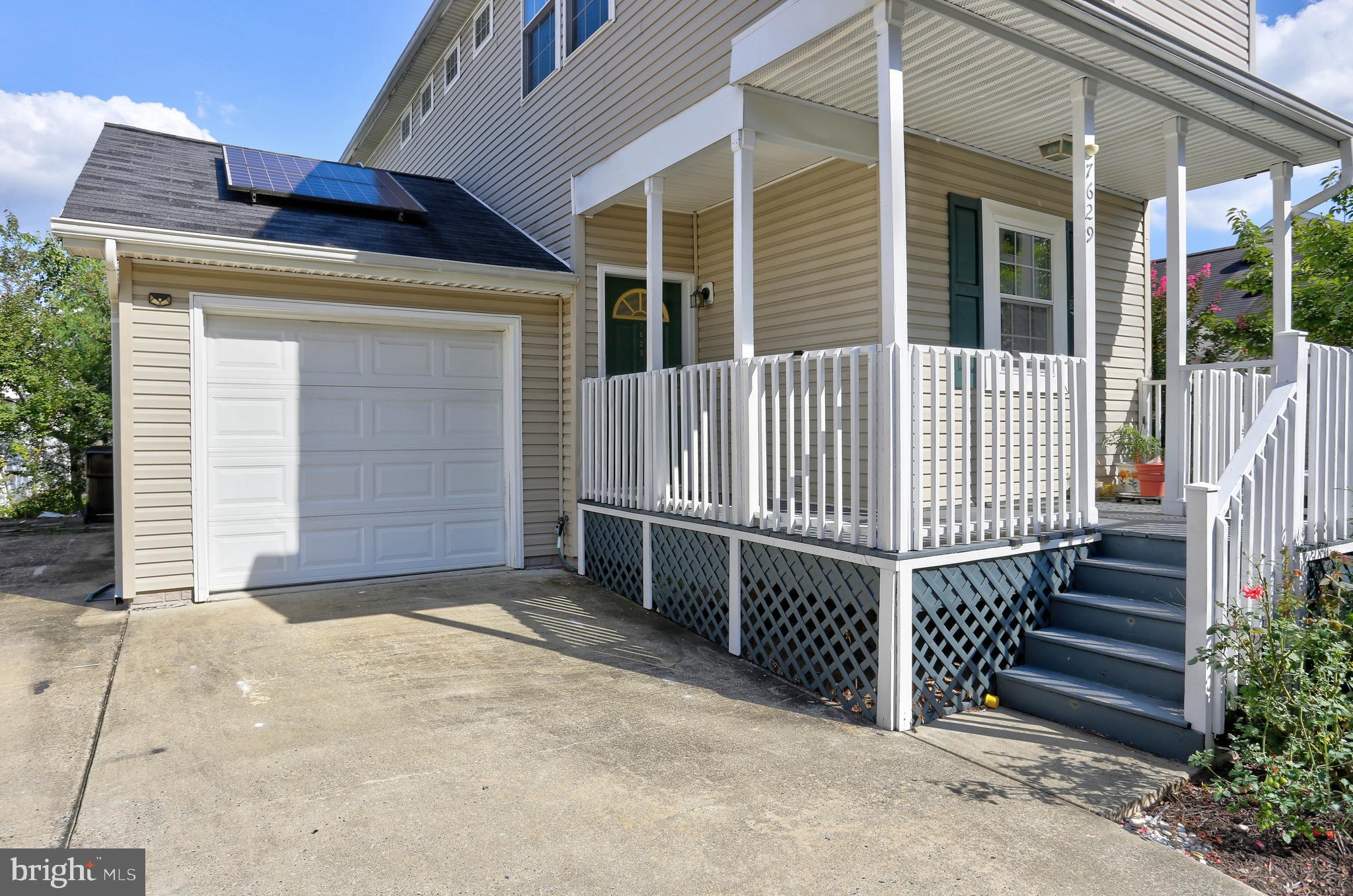 7629 Bluff Point Lane Elkridge, MD 21075 - Photo 28 of 31 a view of a house with wooden fence