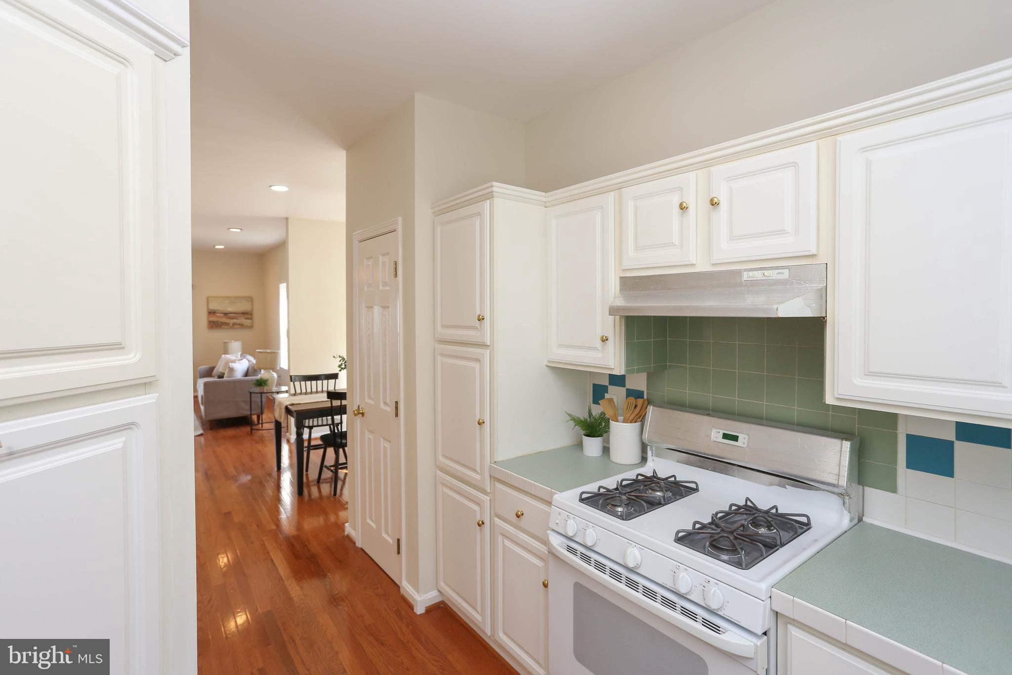 7629 Bluff Point Lane Elkridge, MD 21075 - Photo 5 of 31 a kitchen with stainless steel appliances granite countertop a stove and a refrigerator