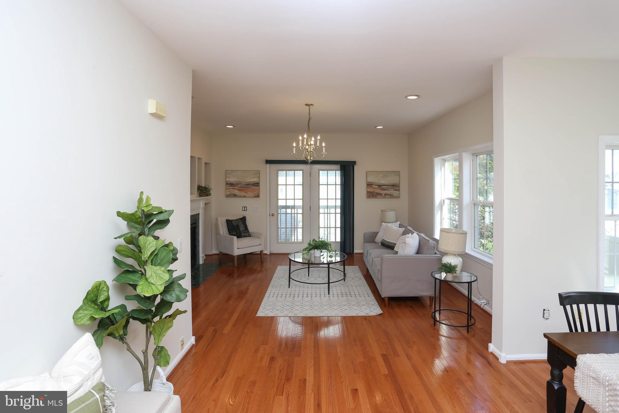 7629 Bluff Point Lane Elkridge, MD 21075 - Photo 7 of 31 a living room with furniture and a fireplace