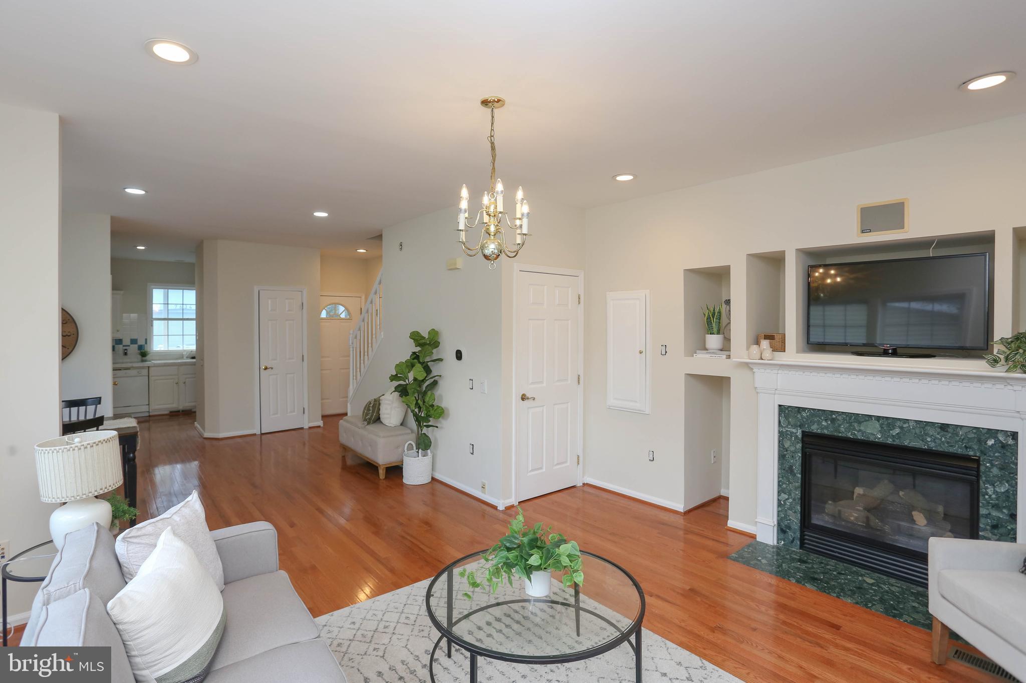 7629 Bluff Point Lane Elkridge, MD 21075 - Photo 8 of 31 a living room with furniture and a fireplace