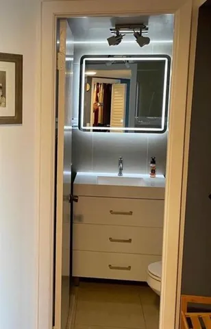 a view of a door and a window