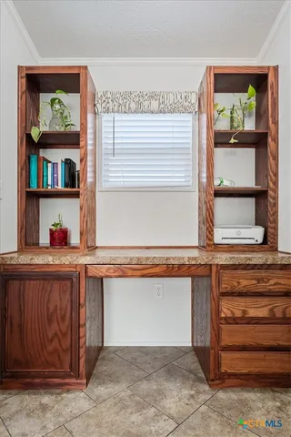 a bed room with a bed and a ceiling fan