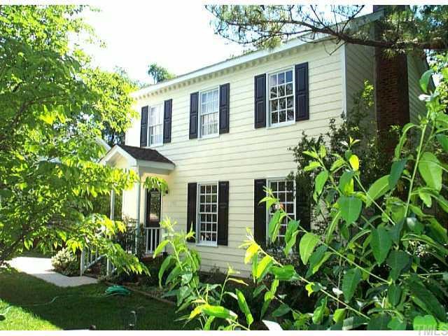 2112 Quail Ridge Road Raleigh, NC 27609 - Photo 1 of 1 a view of a house with potted plants and large trees