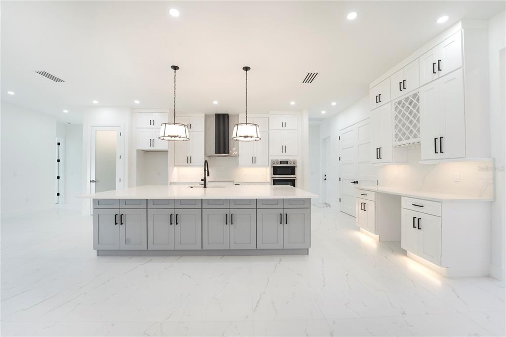 14080 Sydney Road Dover, FL 33527 - Photo 13 of 54 a large kitchen with cabinets
