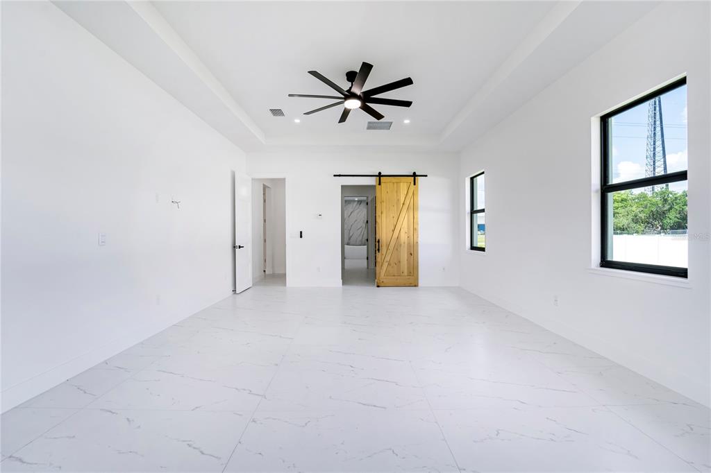 14080 Sydney Road Dover, FL 33527 - Photo 21 of 54 a view of a livingroom with a ceiling fan and window