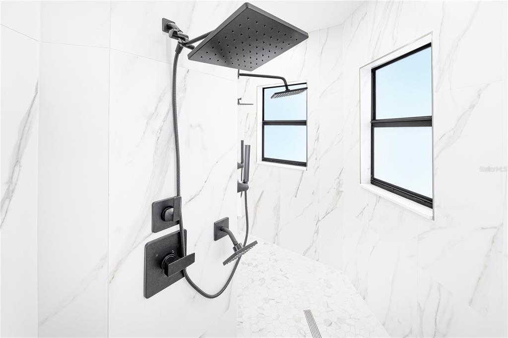 14080 Sydney Road Dover, FL 33527 - Photo 26 of 54 a bathroom with a shower