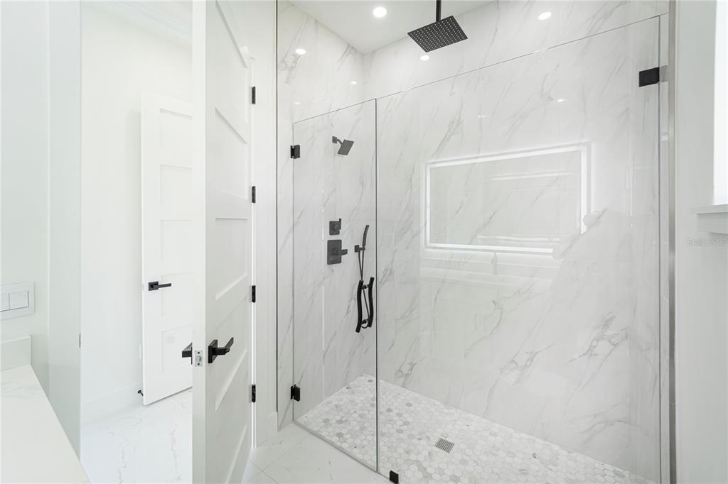 14080 Sydney Road Dover, FL 33527 - Photo 31 of 51 a bathroom with a shower