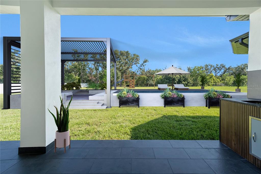 14080 Sydney Road Dover, FL 33527 - Photo 40 of 54 a view of a patio with couches chairs and a potted plant