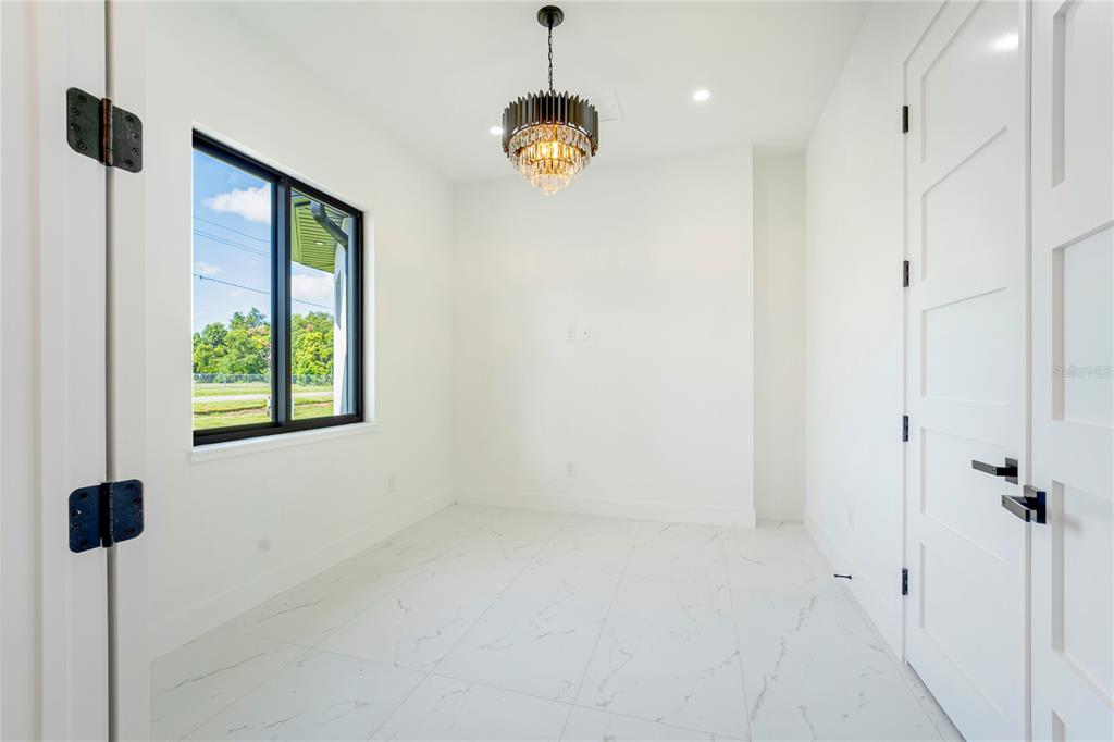 14080 Sydney Road Dover, FL 33527 - Photo 5 of 51 a bathroom with a window and a shower