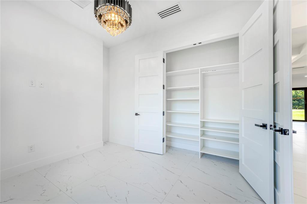 14080 Sydney Road Dover, FL 33527 - Photo 7 of 51 a view of walk in closet with a window