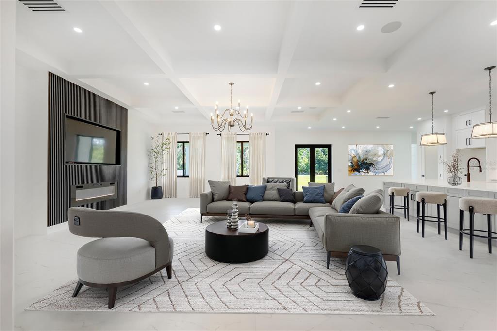 14080 Sydney Road Dover, FL 33527 - Photo 9 of 54 a living room with furniture and a large mirror