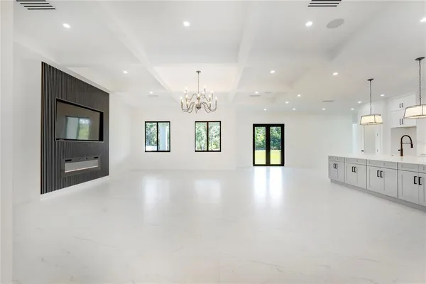 a living room with furniture and a large mirror