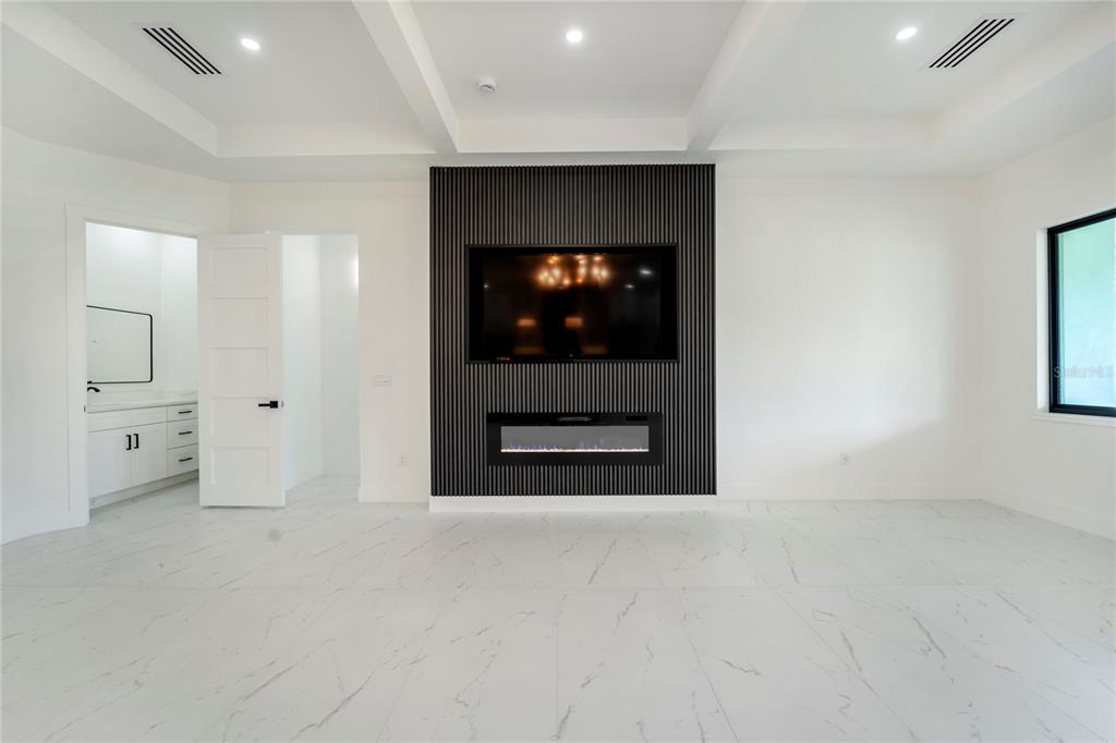 14080 Sydney Road Dover, FL 33527 - Photo 10 of 54 wooden floor in a hall with a fireplace and vanity