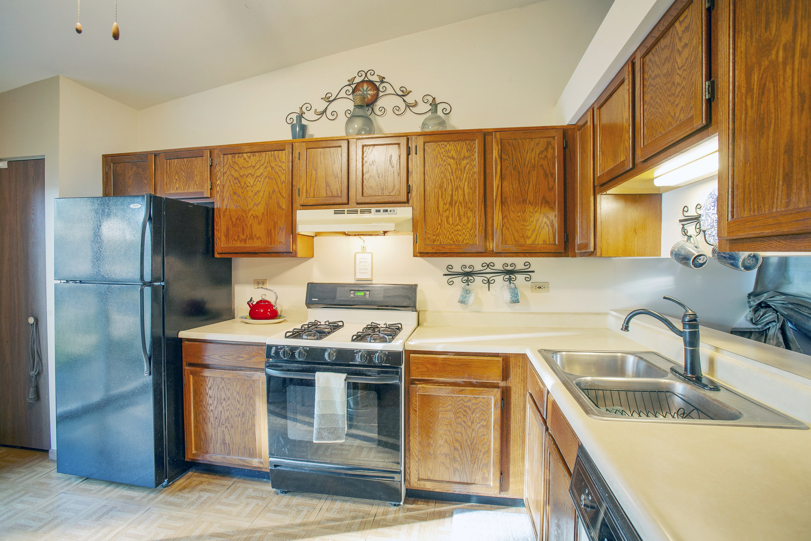 662 Dover Drive Elgin, IL 60120 - Photo 11 of 23 a kitchen with stainless steel appliances granite countertop a sink stove and refrigerator