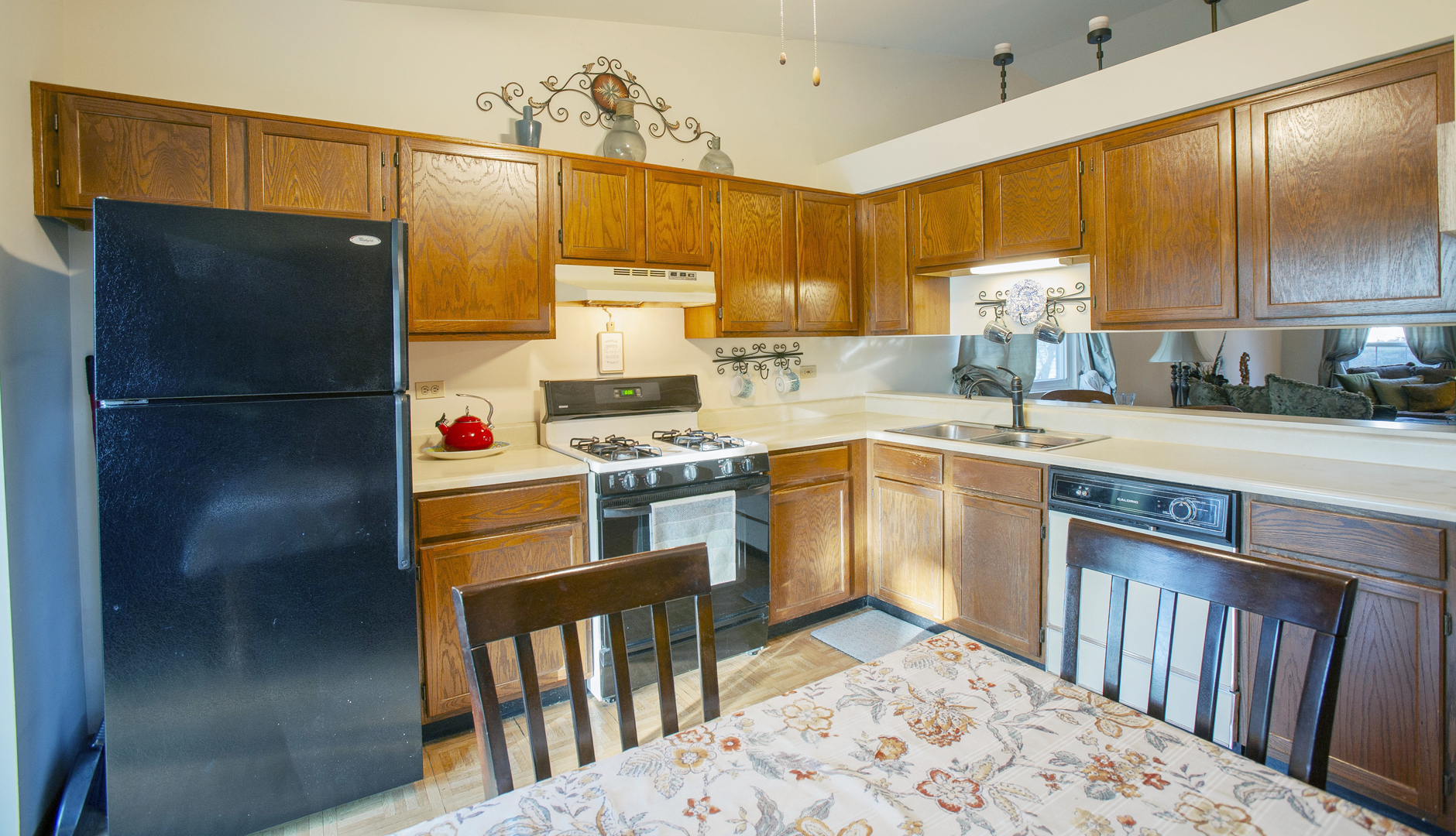 662 Dover Drive Elgin, IL 60120 - Photo 10 of 23 a kitchen with stainless steel appliances a stove a sink and a refrigerator