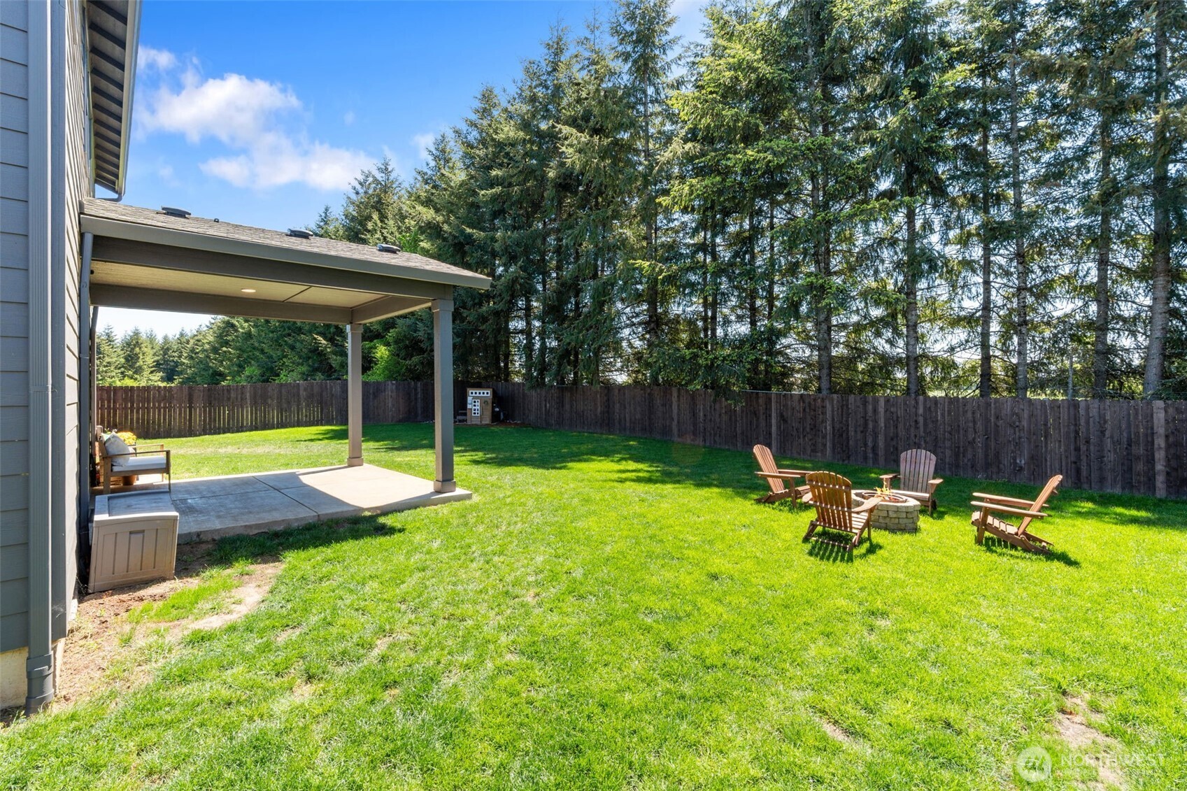 1090 Rw Fletcher Street Winlock, WA 98596 - Photo 33 of 40 a view of backyard with a table and chairs