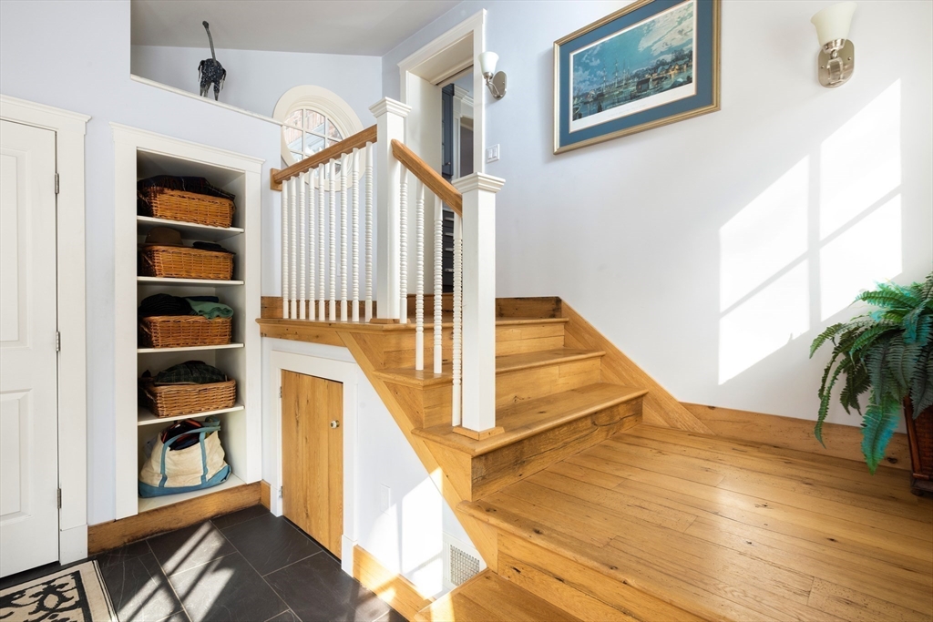 18 Moffat Road Newton, MA 02468 - Photo 16 of 23 a view of a living room with entryway and wooden floor
