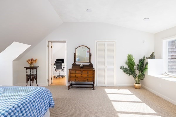 18 Moffat Road Newton, MA 02468 - Photo 18 of 23 a bedroom with a bed and a potted plant