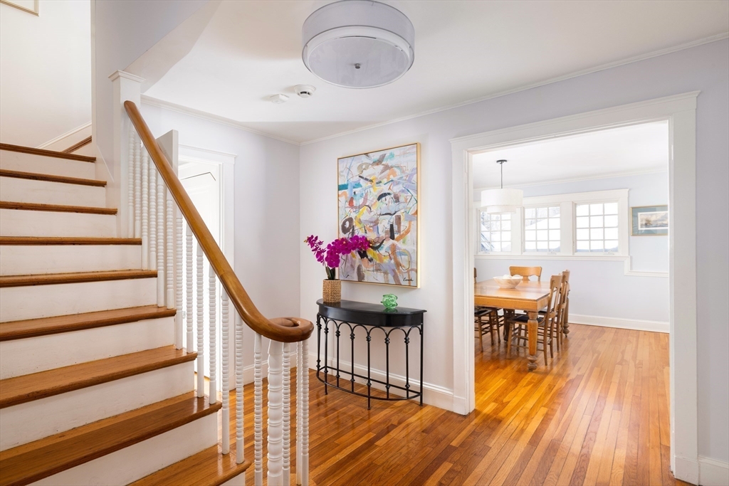 18 Moffat Road Newton, MA 02468 - Photo 2 of 23 a view of entryway dining room and hall with wooden floor