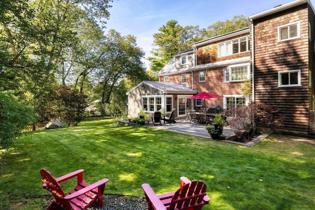18 Moffat Road Newton, MA 02468 - Photo 22 of 23 a view of a house with backyard sitting area and garden