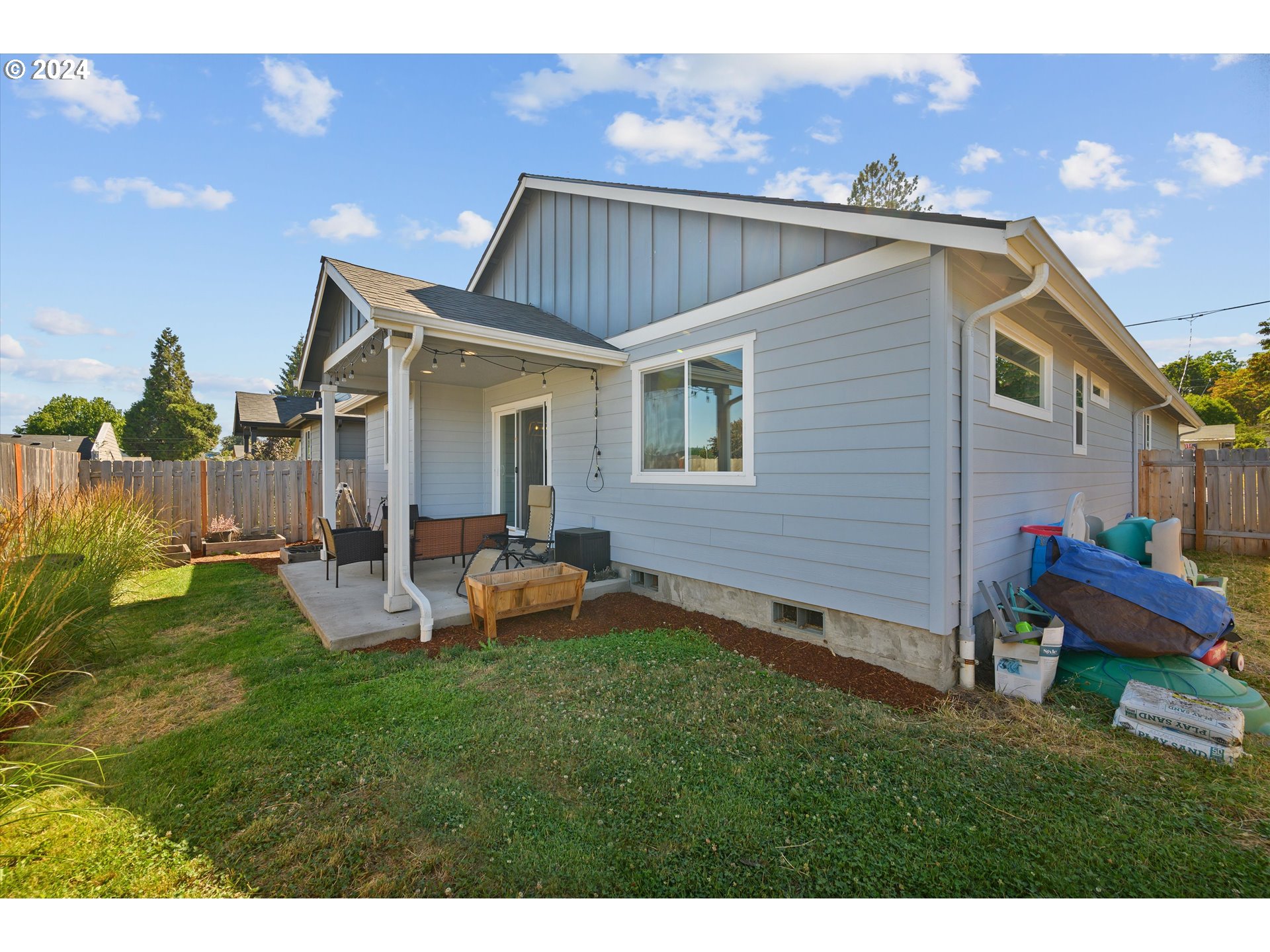 1326 Southwest 9th Street Dallas, OR 97338 - Photo 31 of 32 a backyard of a house with table and chairs