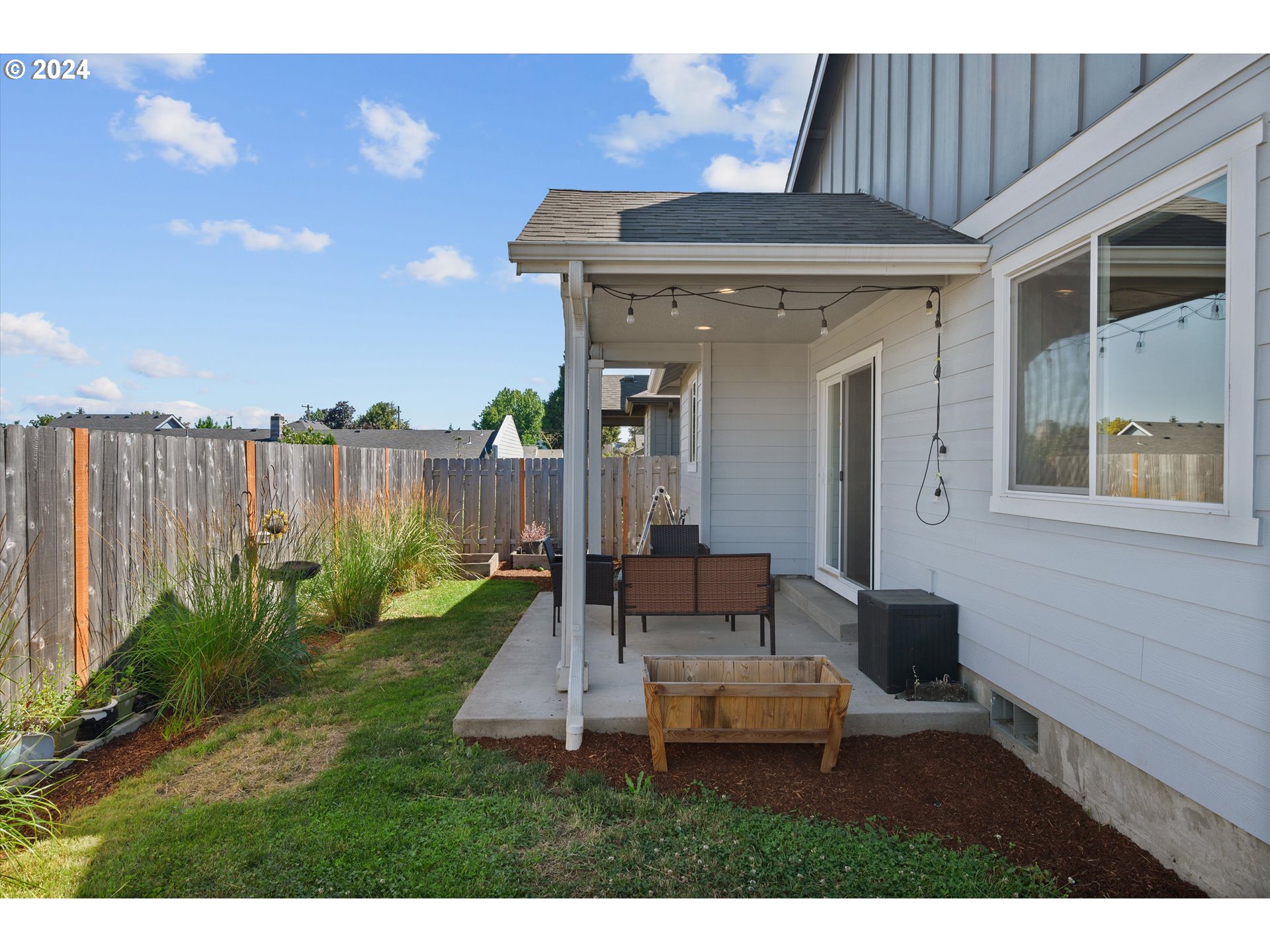 1326 Southwest 9th Street Dallas, OR 97338 - Photo 32 of 32 a view of a patio with table and chairs with wooden fence