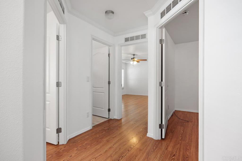 5144 Don Ricardo Drive Carlsbad, CA 92010 - Photo 12 of 34 a view of hallway with wooden floor