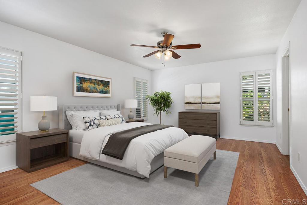 5144 Don Ricardo Drive Carlsbad, CA 92010 - Photo 13 of 34 a spacious bedroom with a large bed and a window