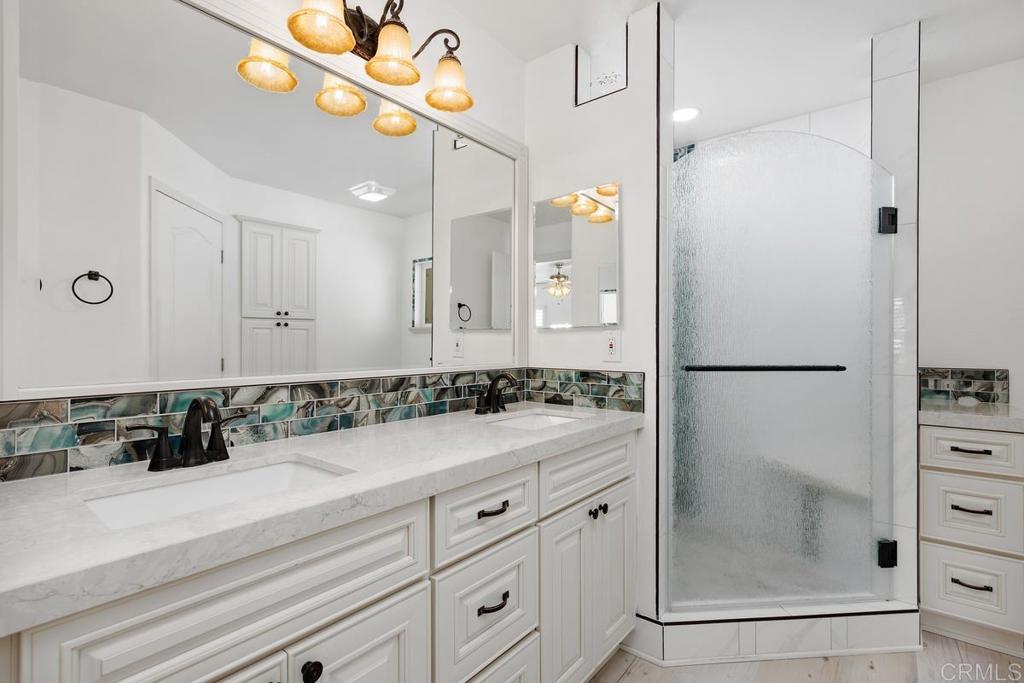 5144 Don Ricardo Drive Carlsbad, CA 92010 - Photo 15 of 34 a bathroom with a shower and a sink