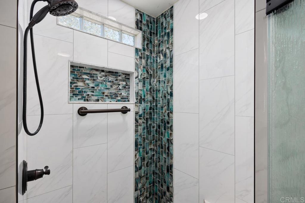 5144 Don Ricardo Drive Carlsbad, CA 92010 - Photo 16 of 34 a bathroom with a shower