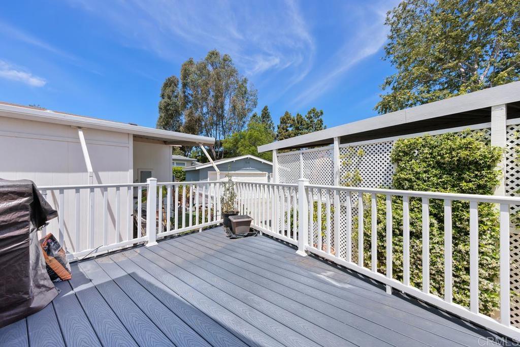 5144 Don Ricardo Drive Carlsbad, CA 92010 - Photo 24 of 34 a view of a balcony with wooden floor and fence