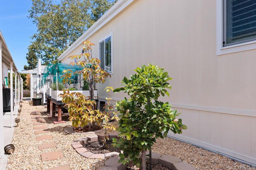 5144 Don Ricardo Drive Carlsbad, CA 92010 - Photo 25 of 34 a front view of a house with a yard