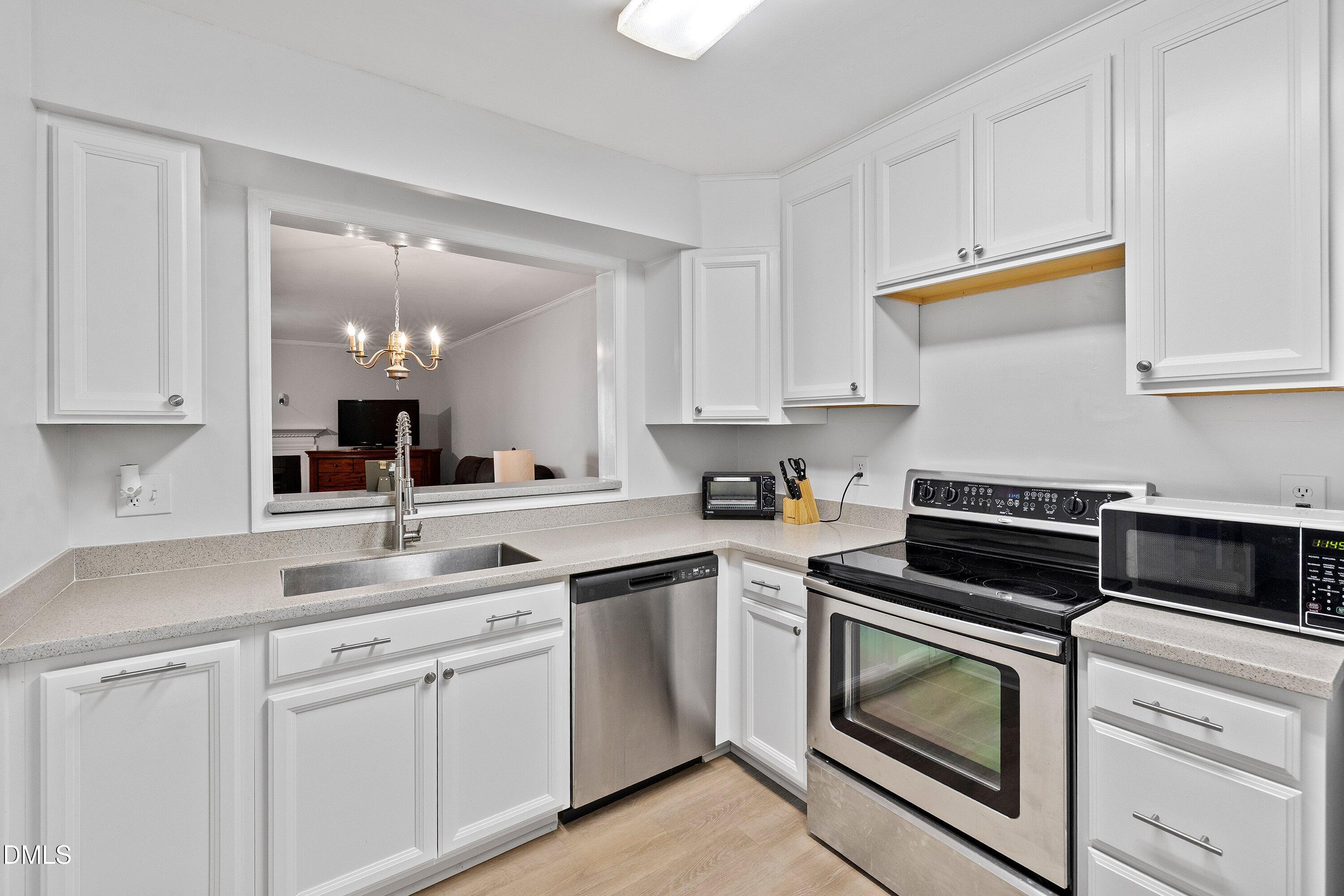305 Broad Leaf Circle Raleigh, NC 27613 - Photo 3 of 15 Updated kitchen with tons of natural light
