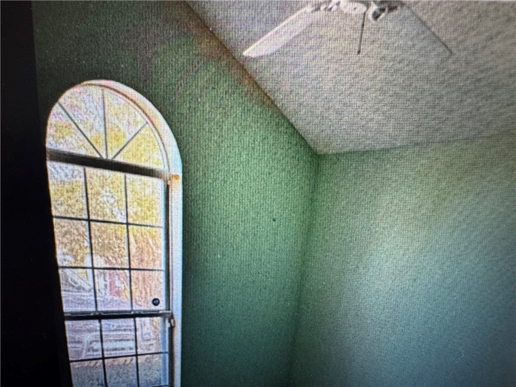529 Mimosa Road Phenix City, AL 36870 - Photo 5 of 11 This interior space features a distinctive arched window, offering unique architectural appeal.