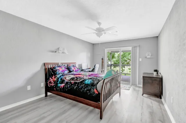 a bed room with a bed and a window