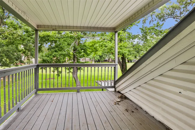 a view of balcony with wooden floor