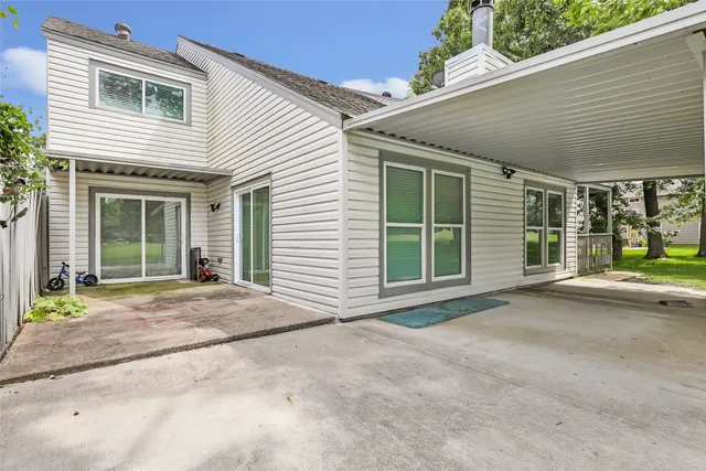 a view of a house with a yard and plants