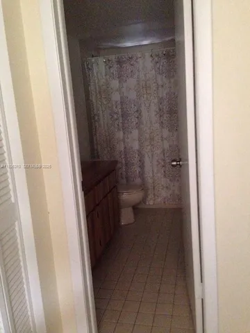 a bathroom with a sink and toilet