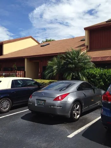 a view of a car parked in front of a house