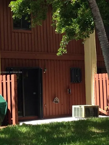 a view of outdoor space with wooden fence
