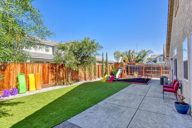 a view of yard with patio
