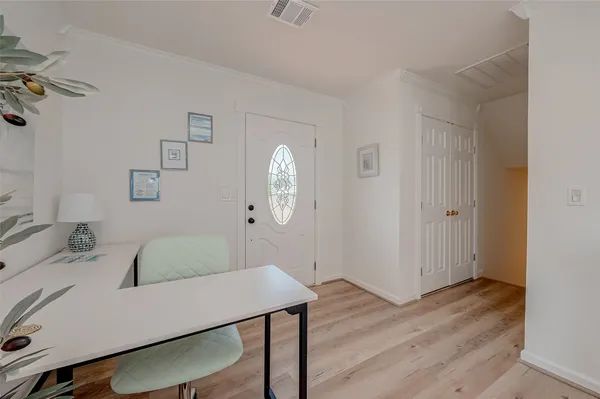 a view of a dining room with furniture and wooden floor