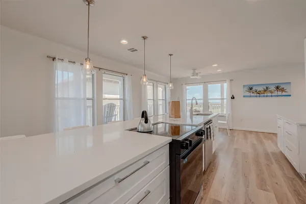 a kitchen with stainless steel appliances a sink stove and refrigerator