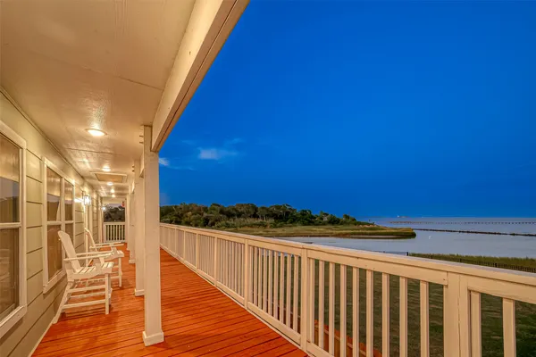 a view of balcony with wooden floor