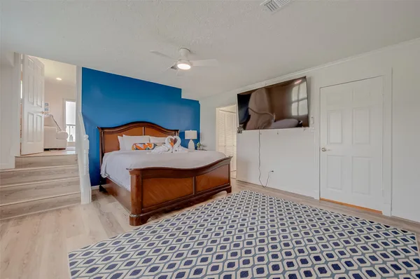a bedroom with furniture and window
