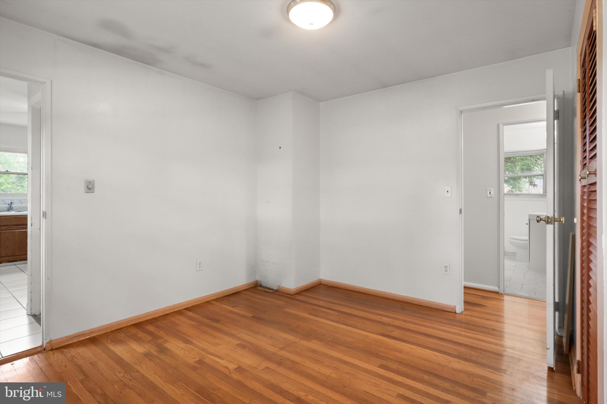 10205 Rodgers Road Fairfax, VA 22030 - Photo 11 of 41 a view of empty room with wooden floor