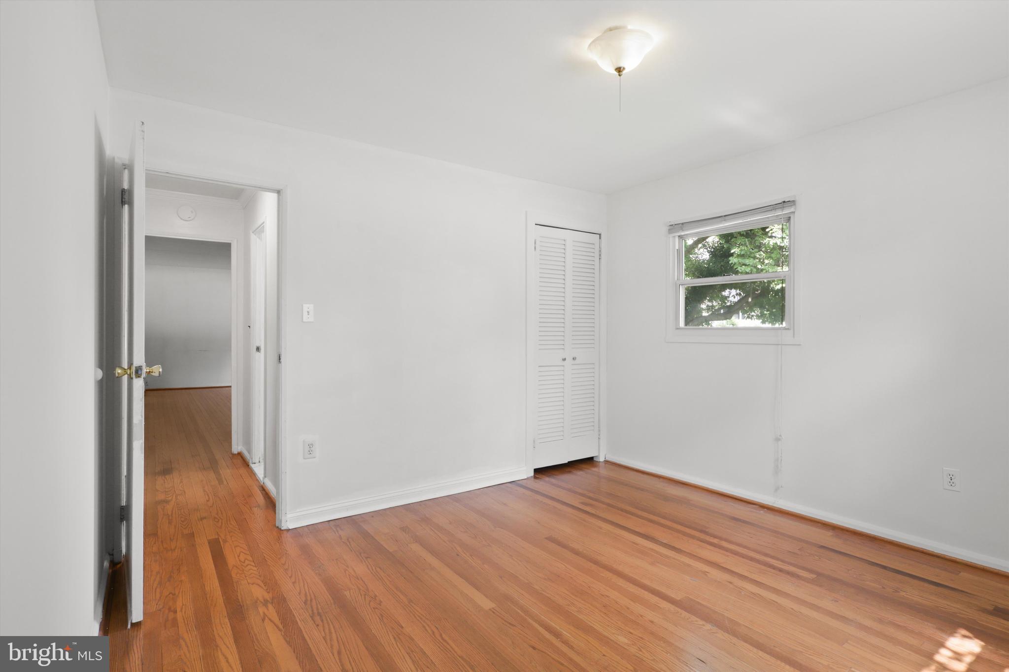 10205 Rodgers Road Fairfax, VA 22030 - Photo 15 of 41 wooden floor in an empty room with a window
