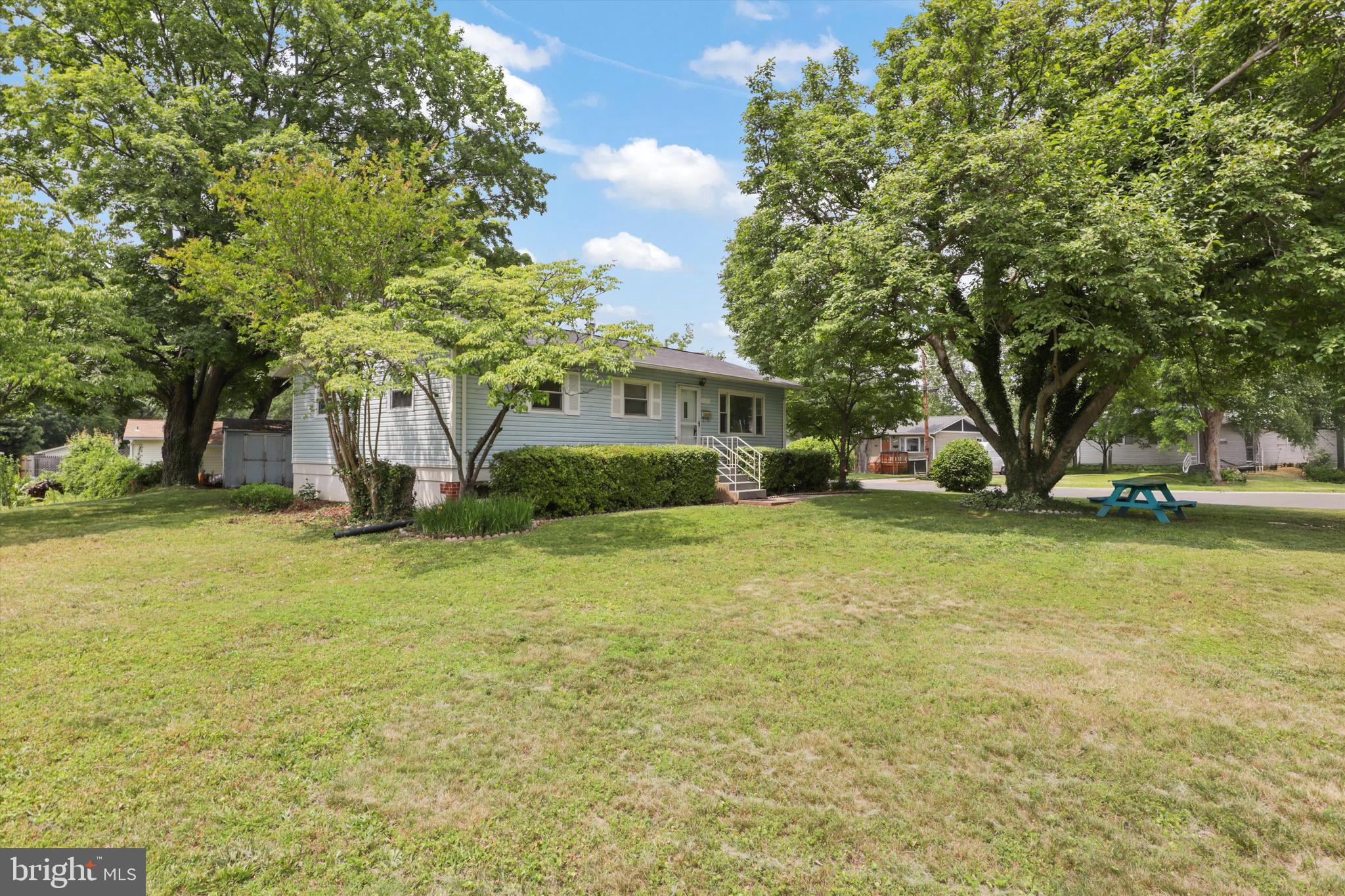 10205 Rodgers Road Fairfax, VA 22030 - Photo 2 of 41 a front view of a house with garden
